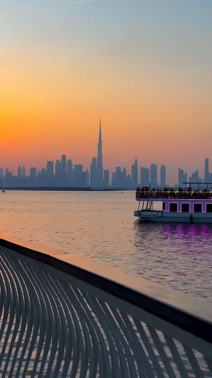 Dubai skyline and waterfront in warm evening light