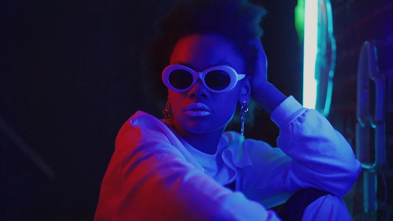 Fashion portrait in saturated blue and red light